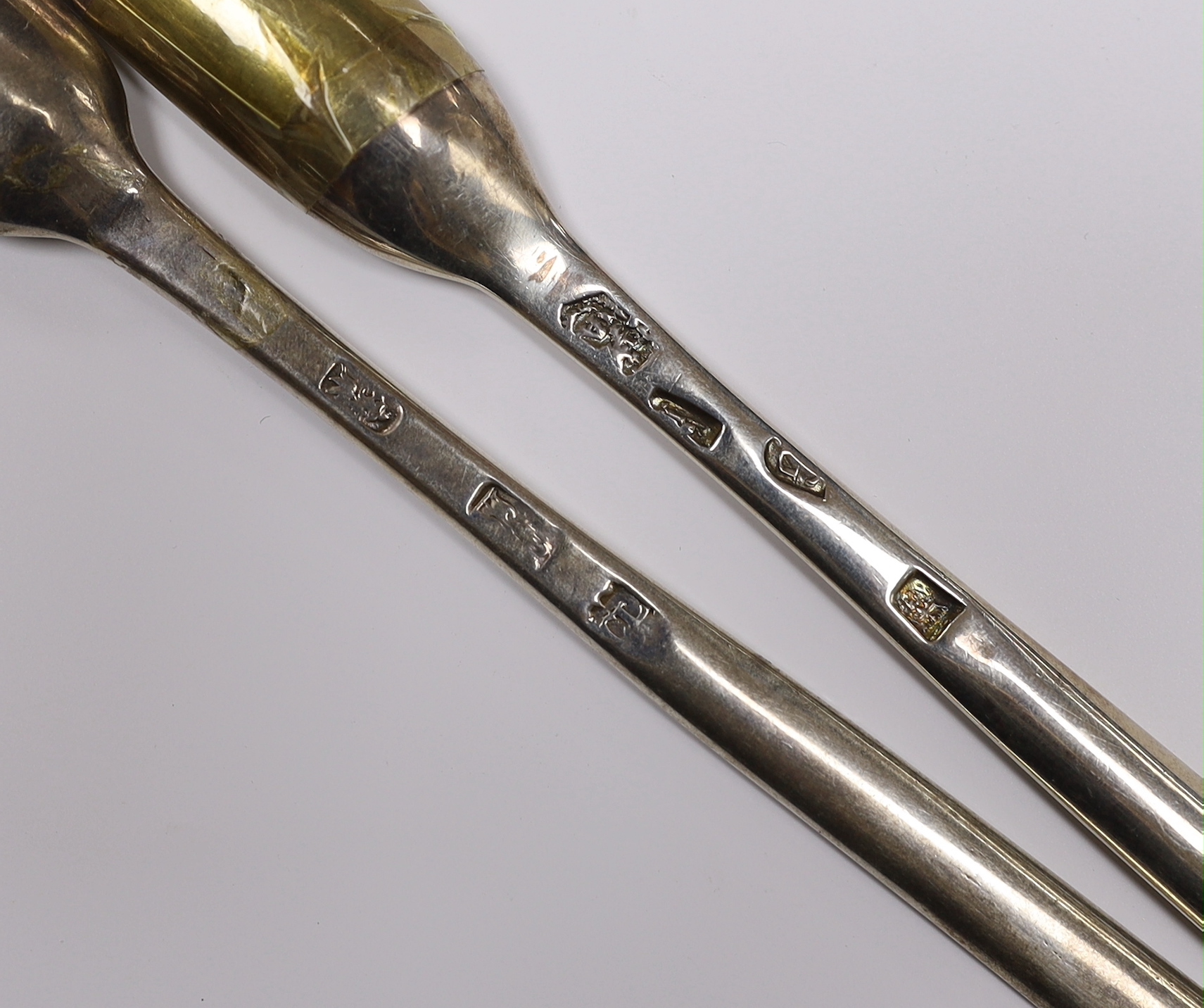 Two early 18th century silver marrow scoops, Henry Clarke I, London, circa 1720 and Andrew Archer, London, 1722, both approx. 21cm, 94 grams.